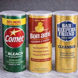 May include: A white ceramic mug with a black handle and the text "But First, Coffee" in a handwritten style. The mug is on a white surface. The mug is approximately 4 inches tall.