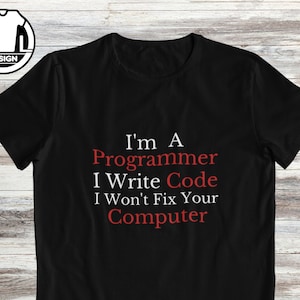 May include: Black t-shirt with white text that reads "I'm a Programmer I Write Code I Won't Fix Your Computer" in red.