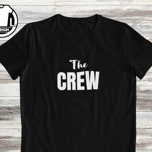 Pode incluir: Camiseta preta com texto branco que diz "The Crew".