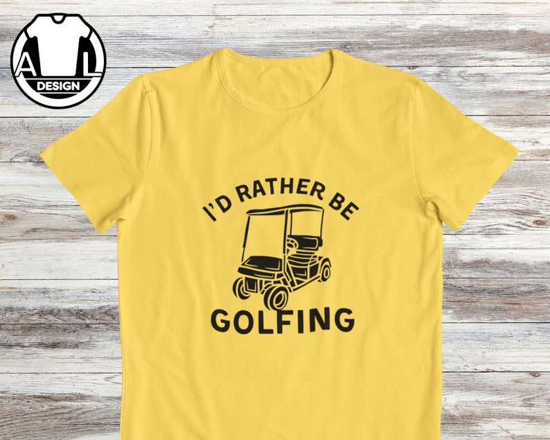 May include: Yellow t-shirt with a black graphic of a golf cart and the text "I'd rather be golfing".