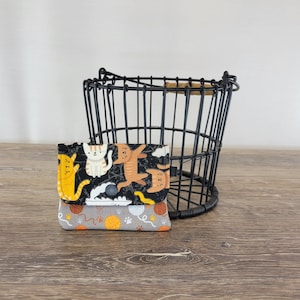 Cartera con broche de gato