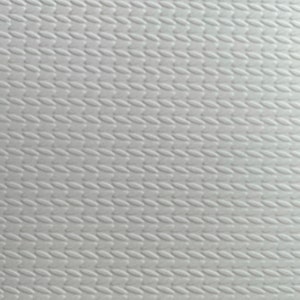 May include: A close-up of a white, textured paper with a repeating pattern of small, oval shapes. The pattern creates a subtle, raised texture across the surface. The paper is clean and bright, with a slight sheen.