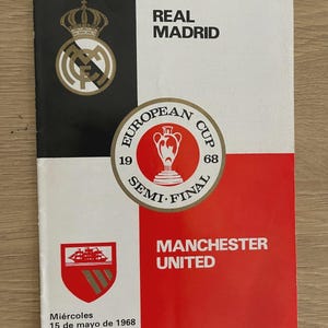 May include: A vintage Real Madrid and Manchester United European Cup semi-final program from 1968. The program features the team logos, the words "European Cup Semi-Final", and the date of the match.