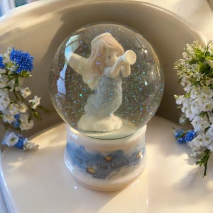 1996 Enesco Precious Moments Musical Snow Globe that plays “Joy to The World”