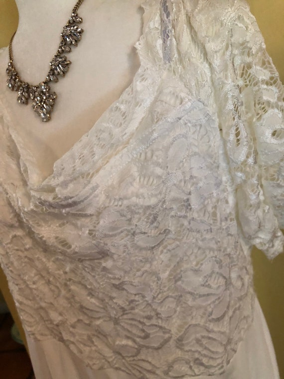 Beautiful Laced Top White Dress that tapers long i