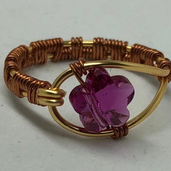 Fine crystal flower ring with woven copper and brass wire. Fuchsia fine crystal flower. Solitaire fine crystal ring. Boho ring.