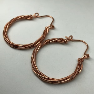 U-shaped earrings with woven copper wire. Copper wire wrapped hoops. Light earrings. Boho earrings.