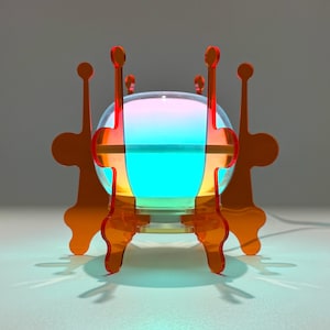 May include: A spherical lamp with a glowing gradient of blue, purple, and orange light, held within a structural frame made of four interlocking orange acrylic panels with tall, slender vertical extensions and rounded decorative cutouts.