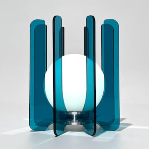 May include: A set of three ceramic mugs with a speckled, matte finish. The mugs are in shades of cream, light gray, and dark gray. Each mug has a simple, minimalist design and a rounded handle.