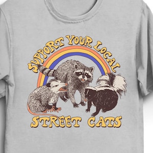 Street Cats T-Shirt - Cool Funny Tee Shirt Gift Opossum Possum Raccoon TrashPanda Skunk Cat Kitten Kitty 80s Retro Cute Pets Rainbow Adopt