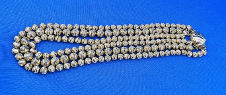 E1 Sarah Coventry Signed Necklace Choker Gold Tone Three Strand Metal Textured Beaded