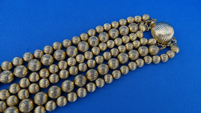 E1 Sarah Coventry Signed Necklace Choker Gold Tone Three Strand Metal Textured Beaded