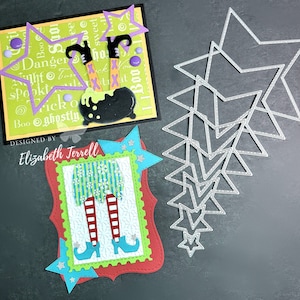 May include: A red, green, and blue card with a witch's legs and a cauldron. The card has a white border and a white star in the corner. The card is designed by Elizabeth Terrell. The card is surrounded by silver metal stars.