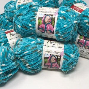 May include: A collection of Premier Yarns Parfait yarn skeins in a variegated turquoise, white, and dark gray colorway. Each skein features a paper label with the brand name, product name, and a photograph of a hooded garment in pink.