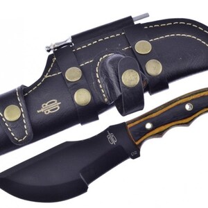 May include: A black fixed blade knife with a brown and black wood handle. The knife has a black leather sheath with a belt loop and a small pocket for a sharpening steel.
