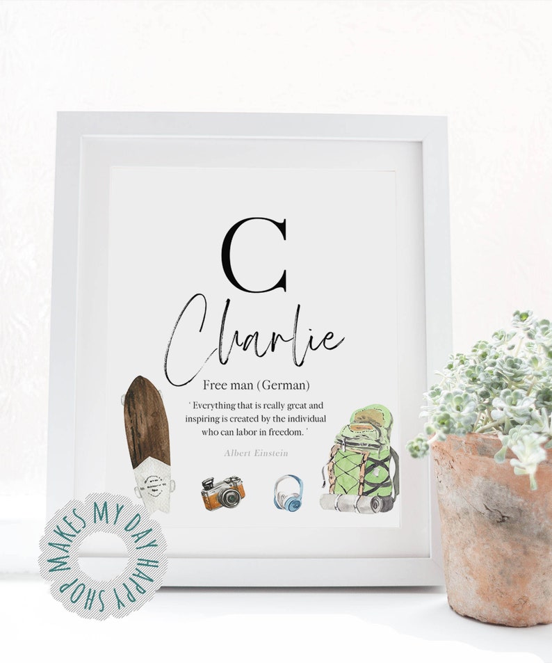 May include: A framed print with the name "Charlie" in cursive, featuring a large "C" and illustrations of a skateboard, camera, headphones, and backpack. The quote by Albert Einstein is also included. A "Makes My Day Shop" sticker is in the lower left corner.