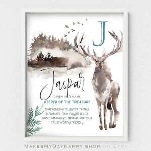 May include: A watercolor print featuring a stag with large antlers, a forest scene, and the letter J in teal. The name "Jaspar" is written in cursive script below the stag, along with the text "Origin is Persian. Keeper of the Treasure." and a list of personality traits.