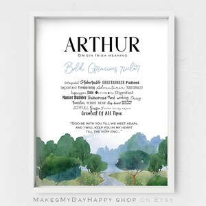 May include: A watercolor print with a blue and green landscape. The print features the name "Arthur" in black text with the meaning "Bold, Gracious ruler" and a list of personality traits associated with the name.