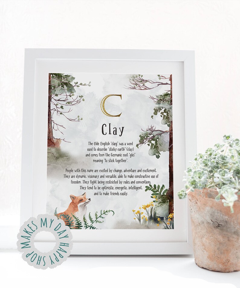 May include: A framed art print with the name "Clay" in a decorative font. The print features watercolor illustrations of trees, a fox, and flowers. The text describes the origin and meaning of the name.