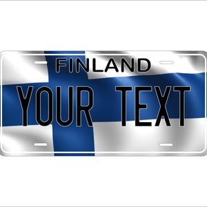 May include: A white and blue license plate with the text "FINLAND" and "YOUR TEXT" on it. The license plate has a blue and white Finnish flag design.