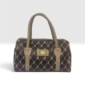 May include: A dark brown handbag featuring a repeating white monogram pattern of the letters A and F arranged in a diamond grid. The bag includes tan leather-like trim, two top handles, and a central gold-toned circular emblem with the letters FA.