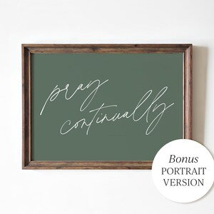 May include: A framed print with the words "pray continually" in white script on a green background. The frame is a dark brown color. A white circle with the text "Bonus PORTRAIT VERSION" is in the bottom right corner.