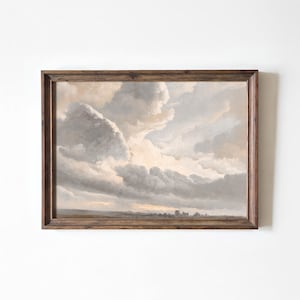 May include: A framed painting of a cloudy sky with a light brown and gray color scheme. The clouds are fluffy and appear to be moving across the sky. The horizon is visible in the distance, with a small town or village.