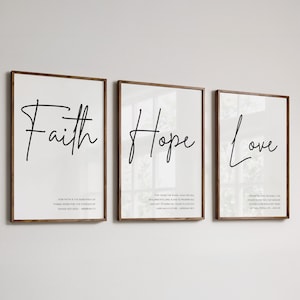 May include: Three framed prints with the words "Faith", "Hope", and "Love" in black cursive script. Each print includes a Bible verse related to the word.