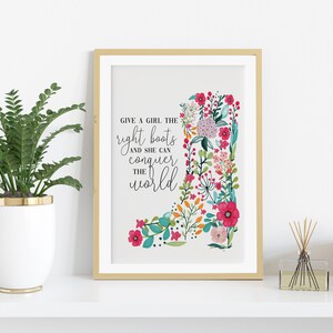 May include: A printable quote about empowering girls with the words "Give a girl the right boots and she can conquer the world" in black text on a white background. The quote is surrounded by a colorful floral design that resembles a boot.