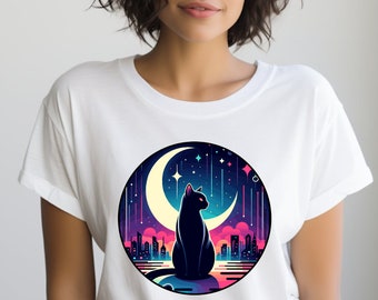 May include: White t-shirt with a black cat sitting on a crescent moon against a backdrop of a city skyline and shooting stars. The moon is yellow and the stars are white.