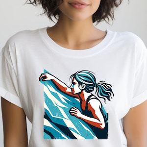 Puede incluir: Una camiseta blanca con un gráfico de una mujer escalando una pared de roca azul y blanca.