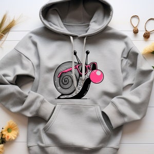 May include: A gray hoodie with a black and white illustration of a snail wearing pink sunglasses and blowing a pink bubble.