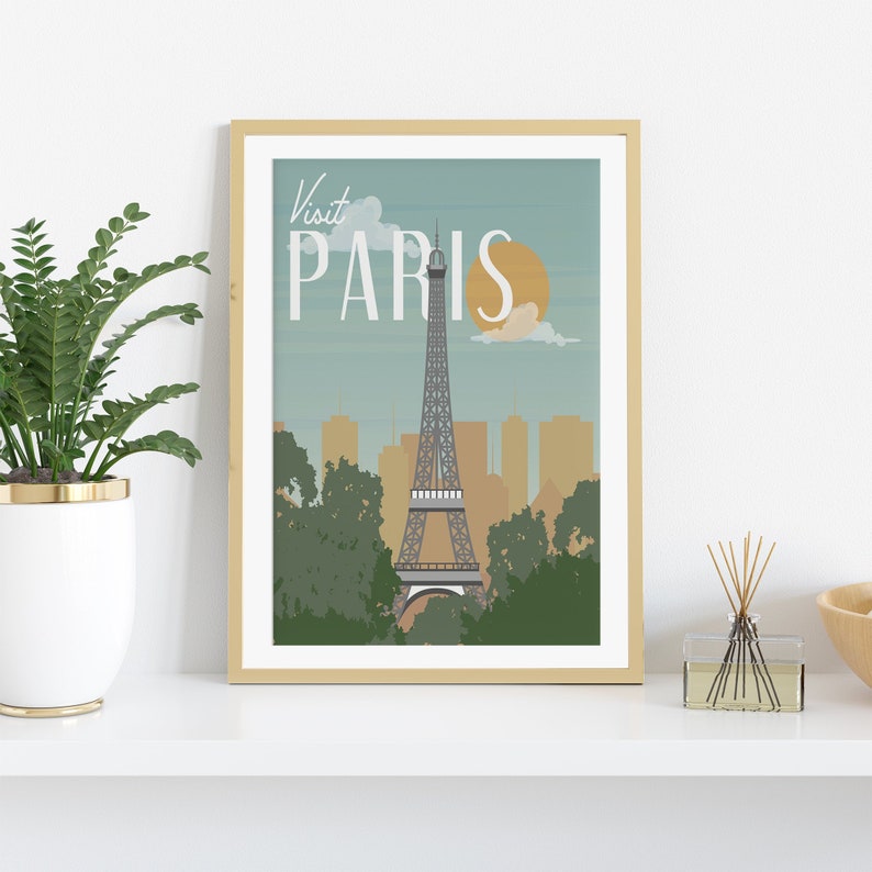 May include: A vintage-style poster with a light blue background featuring the Eiffel Tower in Paris, France. The poster has the text "Visit Paris" in white lettering.