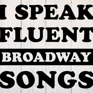 May include: Black and white text on a white wood background reads "I speak fluent Broadway songs".