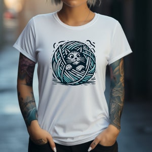 May include: White t-shirt with a graphic of a black cat inside a blue and white yarn ball.
