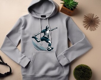 May include: A gray hooded sweatshirt with a graphic of a soccer player kicking a ball. The player is wearing a white jersey and black shorts.