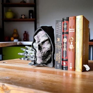 Bone Keeper Book Nook with Skeletal Figure Cloaked in Shadows, Suriel-Inspired Morbid Bookend Decor, Gothic Horror Shelf Accessory