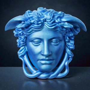 A light blue Medusa head sculpture with snakes for hair and under the chin, against a dark background.