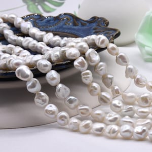 PEARLY GATES - saku A Grade White Keshi Pearls, 7x10mm Long Drilled Freshwater