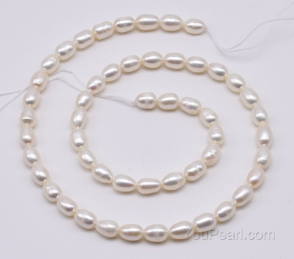 Gorgeous Oval Near Round White Freshwater Pearl Beads with Small Core –  AmpearlBeads