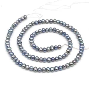 May include: A strand of gray freshwater pearls with iridescent blue and green hues. The pearls are strung on a white thread and are available in various lengths.