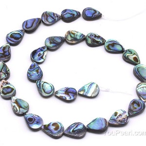May include: A strand of iridescent abalone shell beads in a teardrop shape. The beads are strung on a clear elastic cord and are approximately 1 inch in length.