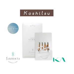 May include: A set of Seeknit Curve bamboo knitting needles, presented in a white package. The needles are light brown with silver connectors and a white cable. The packaging features the text "Seeknit Curve" and "8 Seeknit".