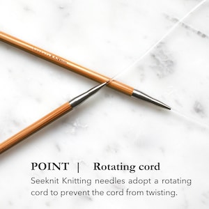 May include: Two light brown bamboo circular knitting needles with silver metal joints and a clear, flexible rotating cord. The needles are marked with the text Seeknit 8 5.00mm. Text on the image reads: POINT | Rotating cord Seeknit Knitting needles adopt a rotating cord to prevent the cord from twisting.