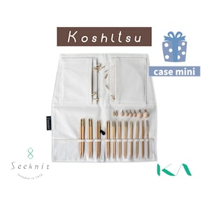 May include: A white fabric organizer case labeled Koshitsu case mini containing a set of bamboo knitting needles with gold metal connectors, circular cables, and small wooden end caps. The Seeknit brand logo is visible on the side of the case.