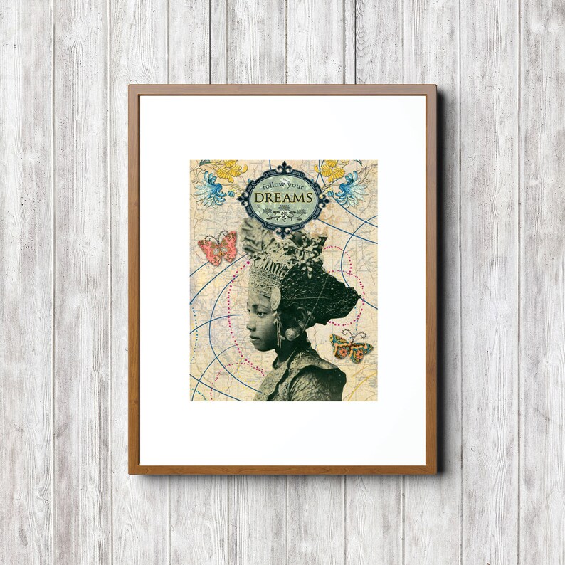 May include: A framed print with a vintage map background featuring a woman with a headdress and the text "Follow Your Dreams". The woman is looking to the side and has a butterfly on her shoulder.