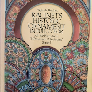 May include: Book cover featuring a colorful illustration of ornate designs in blue, red, green, and gold. The title is "Racinet's Historic Ornament in Full Color" and the subtitle is "All 100 Plates from 'L'Ornement Polychrome' Series I."