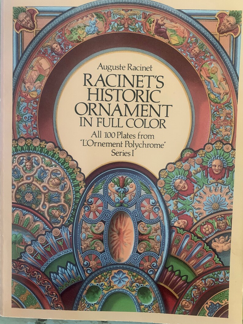 May include: Book cover featuring a colorful illustration of ornate designs in blue, red, green, and gold. The title is "Racinet's Historic Ornament in Full Color" and the subtitle is "All 100 Plates from 'L'Ornement Polychrome' Series I."