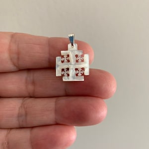 Bethlehem’s Sacred Artistry: Mother of Pearl Jerusalem Cross.  Approx. Size 2cm x 3cm including the jump ring.
