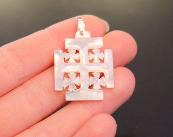 Bethlehem’s Sacred Artistry: Mother of Pearl Jerusalem Cross. Approximate size 2.5x3cm including the jump ring.